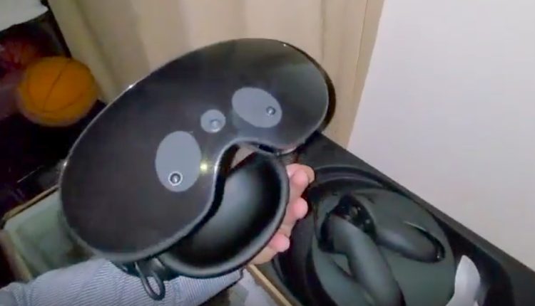Quest Pro: Video screenshot of Oculus Quest 2 successor with hand holding black headset