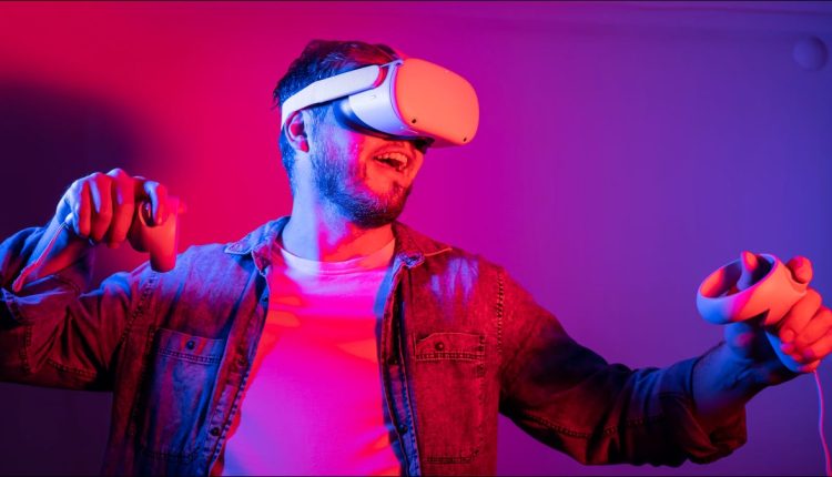 Man wearing a VR headset and holding his arms up in an action-ready pose.